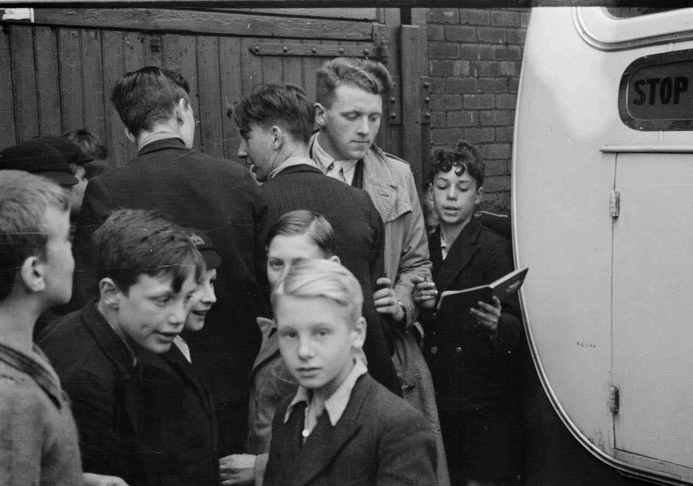 Boys ask for footballers’ autographs after a Bolton Wanderers reserve team game at Burnden Park, September 25th 1937