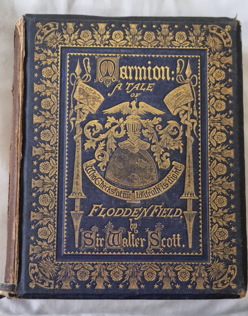 The binding of Marmion in blue cloth with gilt decoration