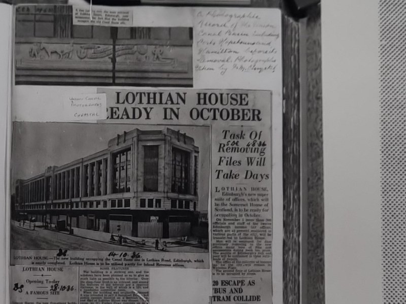 A photocopy of the first page of an album of photographs of the Edinburgh Union Canal showing newspaper clippings of the new Lothian House.
